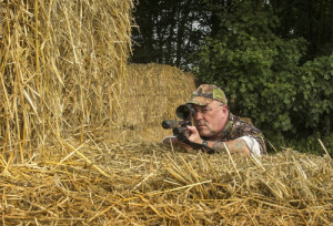 Ian uses a straw bale as a sniping support