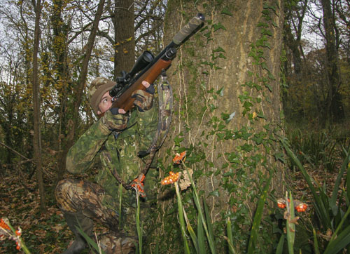  Mat takes aim at a woodpigeon after using the whistling wind to mask the sound of his approach