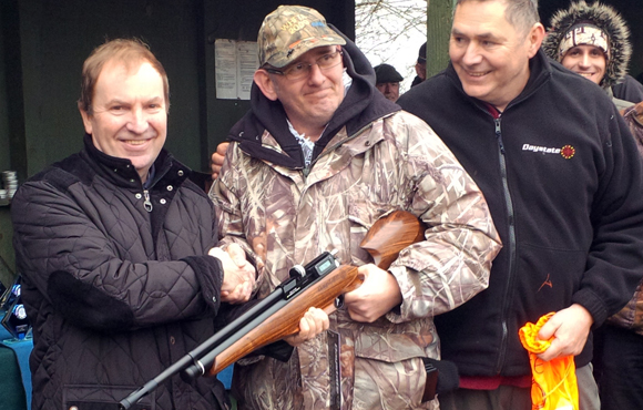 Sunday, 1st March 2015. Kibworth Shooting Ground. XXX (centre) receives his Daystate MK4 prize from Daystate MD Tony Belas (left), while event organiser XXX watches on...